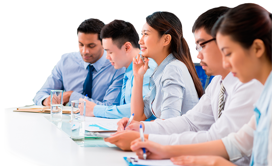 Five office personnel at a table.